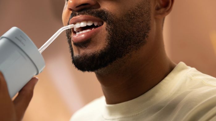 Іригатор Philips портативний Sonicare Compact Flosser 1000, чаша 200 мл, складний, голубий