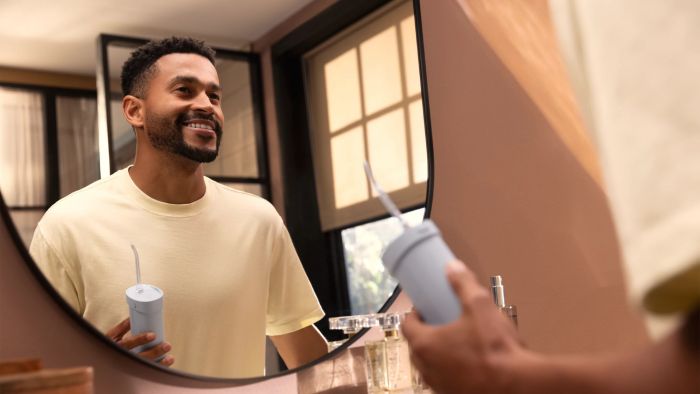 Іригатор Philips портативний Sonicare Compact Flosser 1000, чаша 200 мл, складний, голубий