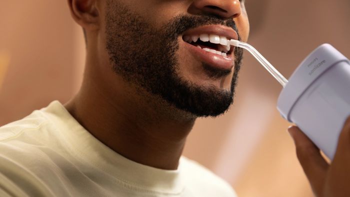 Іригатор Philips портативний Sonicare Compact Flosser 1000, чаша 200 мл, складний, фіолетовий